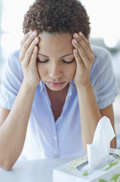 woman with hands on head stressed