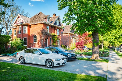 multiple cars in a driveway